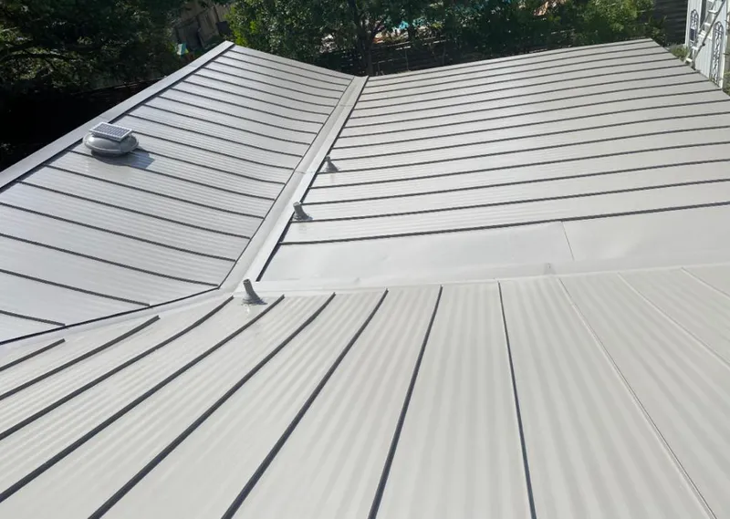 Solar attic fan installed on a metal roof for Roof Ventilation in Wabash